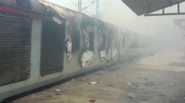 Indian protesters set train on fire and cause damage against new government plan