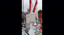 A sign at Parliament Square London Living Crisis Protest that reads -