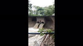 Watch this man having a lucky escape as the bridge he walks across caves in due to floods!