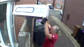 Online shopper shocked after delivery driver chucks $1,100 worth of electronics over fence