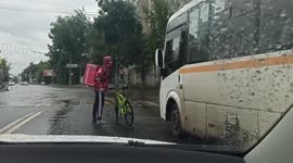 Food delivery man falls after hitting minibus