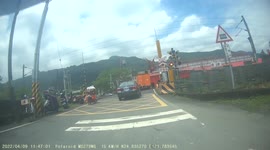 WTF Moment: Grandma laughs when level crossing bar smashes on a vehicle's roof! (Dashcam Video)