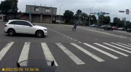 Father rescues son who rode scooter into middle of busy road in Taiwan