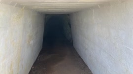 walking through a pedestrian tunnel in the Marin Headlands  - hand hewn tunnel
