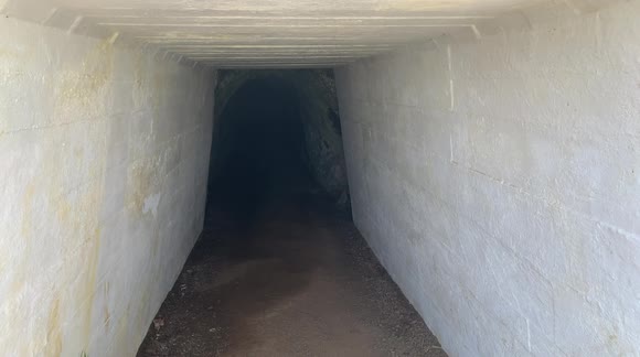walking through a pedestrian tunnel in the Marin Headlands  - hand hewn tunnel - Buy, Sell or Upload Video Content with Newsflare
