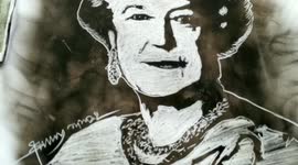 Artist create portrait of Queen Elizabeth II using fire & smoke on a piece of paper in Eastern India.