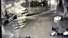 Chinese man drives forklift to transfer eight cars away from flooded road