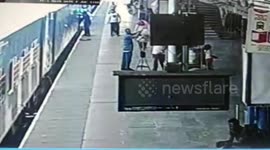 Close shave for elderly man as he escapes being run over despite falling under moving train in northern India