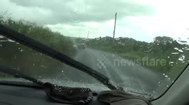 Freak hail and snow storms hit north cornwall in june , causing flash flooding and poor driving conditions