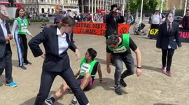 Climate activists dressed as G7 leaders play rigged game of football against the Global South on Parliament Square