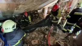 Body pulled from rubble of nine-storey Kyiv building after Russian strike