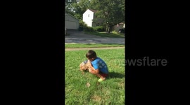 Boy Picks Up Dog Poop