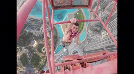 Fearless free climber poses as workman to scale 1,280-foot crane in Dubai