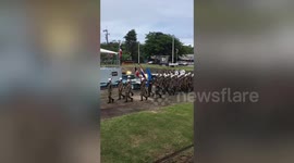 Soldiers perform awesome synchronised patrol dance next to warship