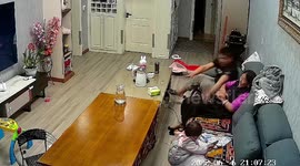 Quick-thinking father dives to catch daughter falling off sofa in China