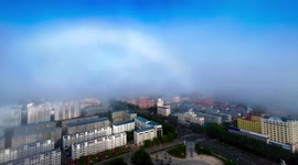 Rare white rainbow lingers above city in northern China