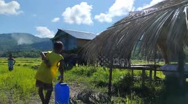 Kind residents help carry neighbour's house across rice field in the Philippines