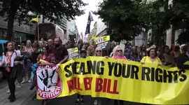 Anti government Bills protesters make their way through Central London on the same day as Pride