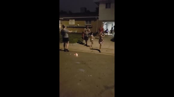 Little girls celebrating July 4th and dancing shadows with fireworks