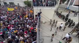Sri Lanka unrest: Watch moment protesters climb up gates of presidential palace