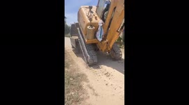 Impressive digger driver loads vehicle onto truck in seconds