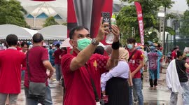 Manchester United and Liverpool fans brave the rain for friendly match in Bangkok