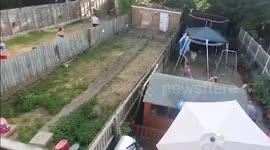 Neighbouring families beat the heatwave with epic water fight across gardens