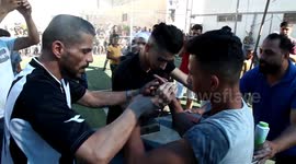 Palestinian youths compete in an arm-wrestling championship in Gaza City