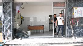 Palestinians inspect site targeted by Israeli airstrikes in Gaza City