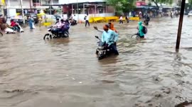 Driving through flood water: India hit by heavy rainfall