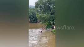 Three men rescue boy washed away in reservoir in China