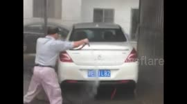 Happy car washer cleans cars with dancing martial arts moves