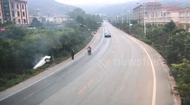 Two cars drift in succession on slippery road in China