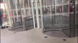 Extinction Rebellion activists smashed windows at the entrance to the News UK offices at London Bridge