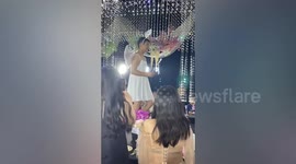 Boy dresses as angel to hand elder sister ring at wedding in China
