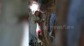 UK family remove section of wall 'brick by brick' to save pigeon trapped chimney for THREE DAYS