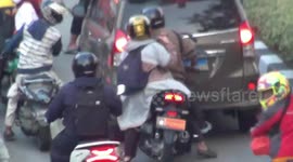 Dozens of Motorists Are Desperate to Enter the Trans Jakarta Indonesia Bus Line