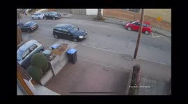 Terrifying moment car smashes into parked car before flipping on it's side in residential street