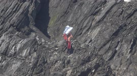 Ex Commandos scale Goose rock Newquay Cornwall to retrieve equipment for Charity Rockall assault. East Pentire Cornwall.