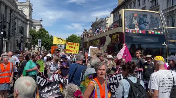 Protesters block Parliament Square during a climate and cost of living