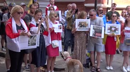 Playful dog at protest in support of Ukraine and the Rail Workers of Belarus outside Belarus Embassy in London