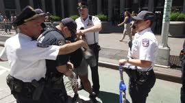 WATER GUNFIGHT ARRESTS outside Fox News Headquarters as Andrew Giuliani spoke outside. Supporters and counter-protesters clashed, resulting in arrest of two supporters of the rally.