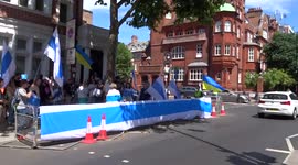 Russian-speakers gather outside the Embassy of Russia in London with a message of peace