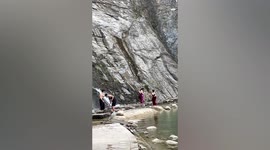 Huge rock narrowly misses tourists after tumbling down mountain in eastern China