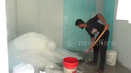 Palestinians work at Ice factory to freeze fish during the summer in Gaza city.