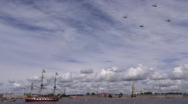 Helicopters fly over river Neva at the General rehearsal for Navy Day in St Petersburg, Russia