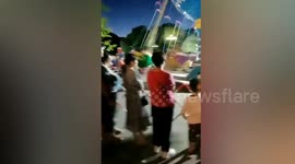 Swing ride tips over injuring 1 in northern China