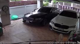 Strong winds blow ceiling decor onto  luxury car in family's garage in Thailand