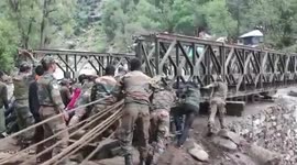 Army personnel swiftly construct bridge after floods wash away previous crossing in Jammu and Kashmir