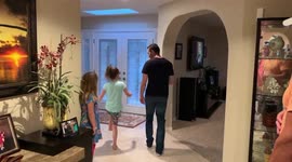 Brother teaches little sister how to dance